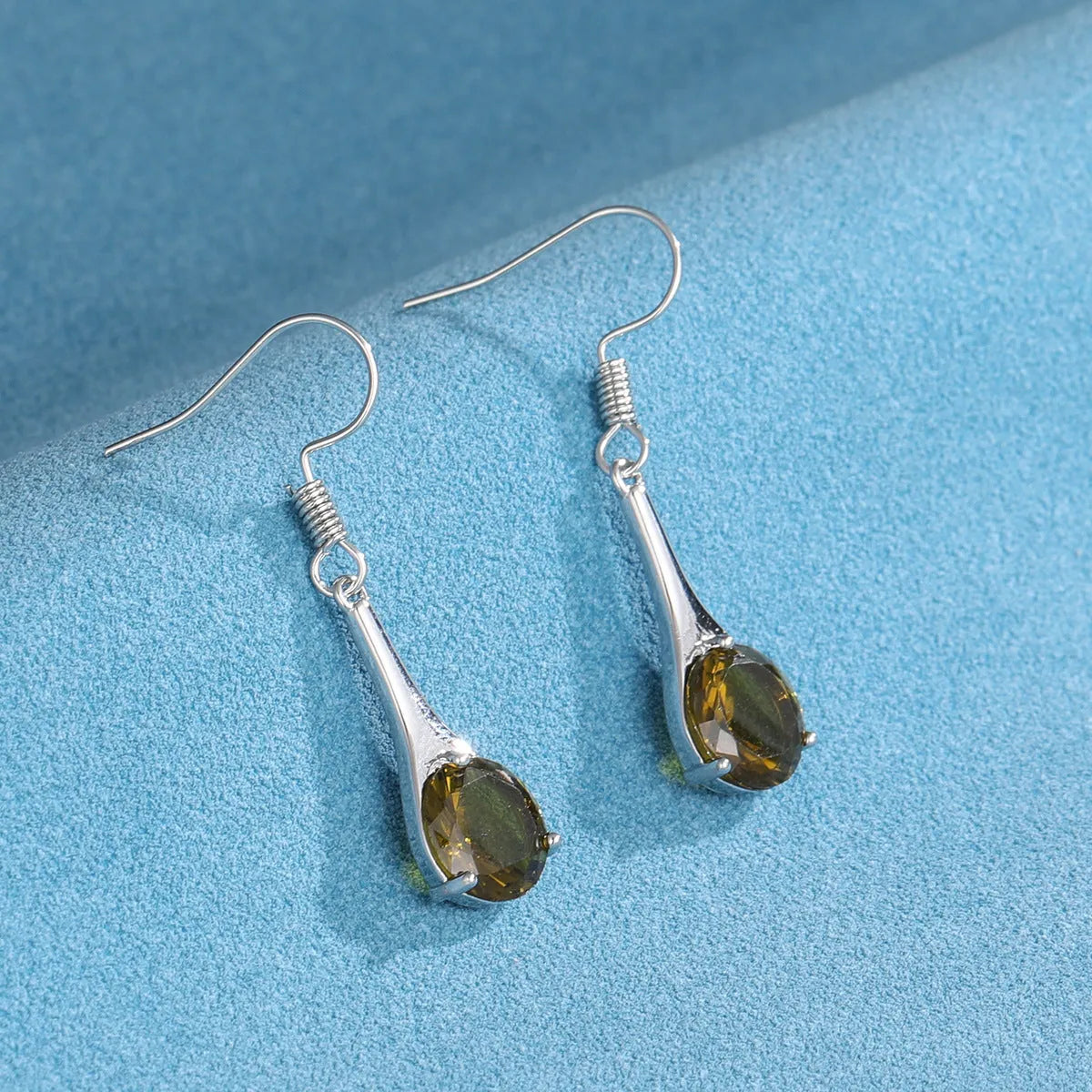 Olive green topaz drop earrings with water drop shape and gold electroplated finish