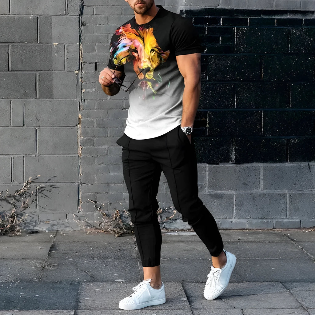 Men's grey printed short-sleeved tracksuit top and trousers laid flat.