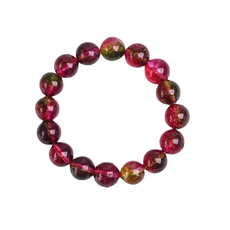 Handmade watermelon-coloured crystal bracelet for women shown in casual style.