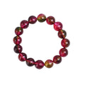 Handmade watermelon-coloured crystal bracelet for women shown in casual style.