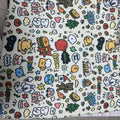 Blue Puppy cartoon print nylon cosmetic bag in medium size on a plain background.