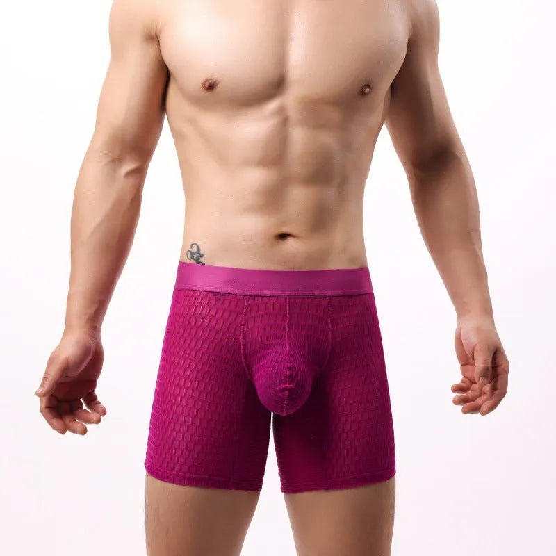 Men's white lace mesh boxer shorts with low waist design on a plain background