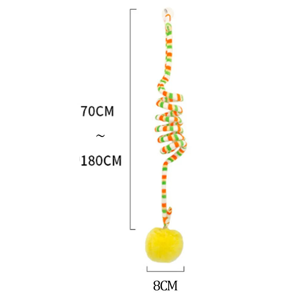 Colourful suction cup cat toy with spring wand and inflatable ball, hanging on a glass door