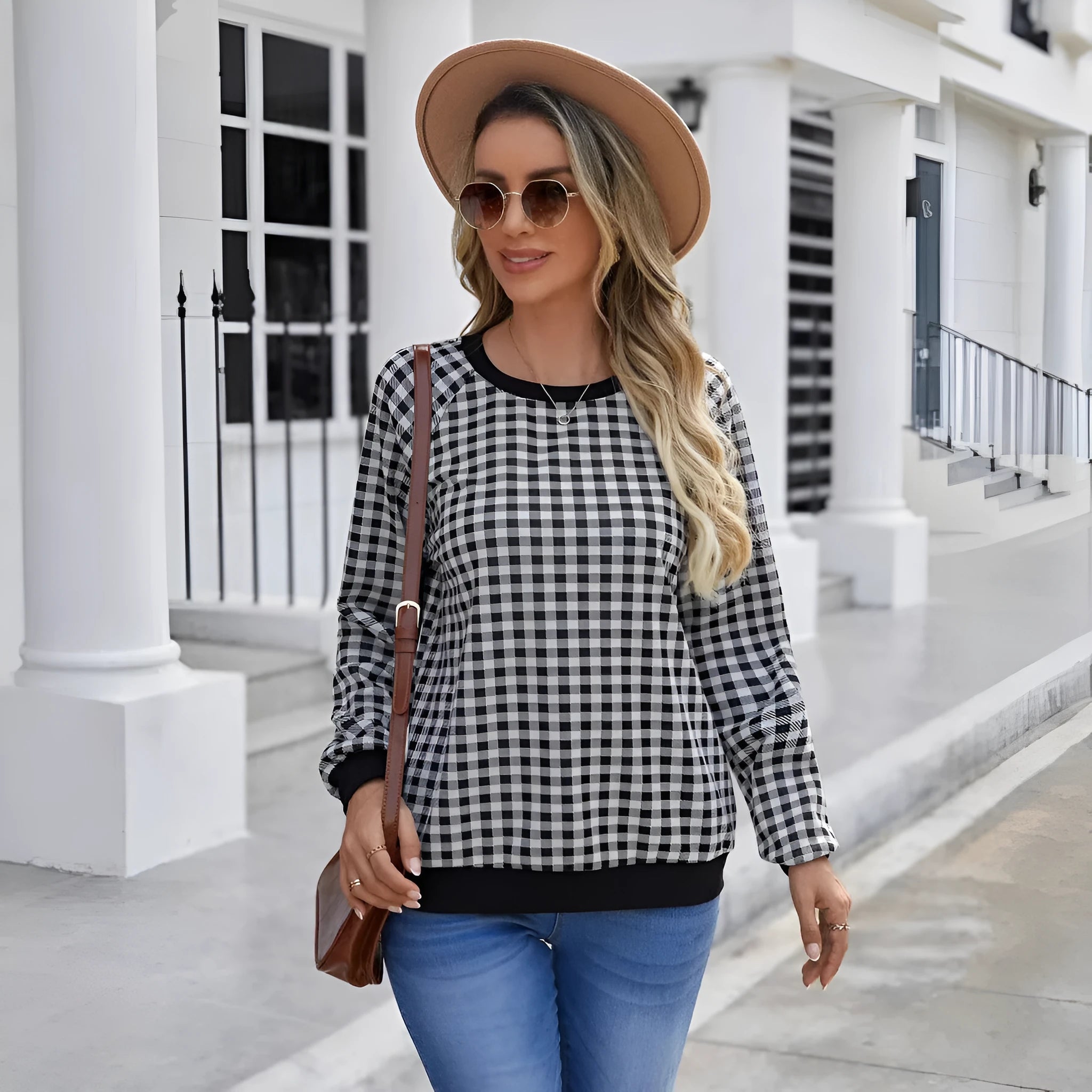 Black long sleeve pullover sweater with a Japanese plaid pattern, shown on a hanger.