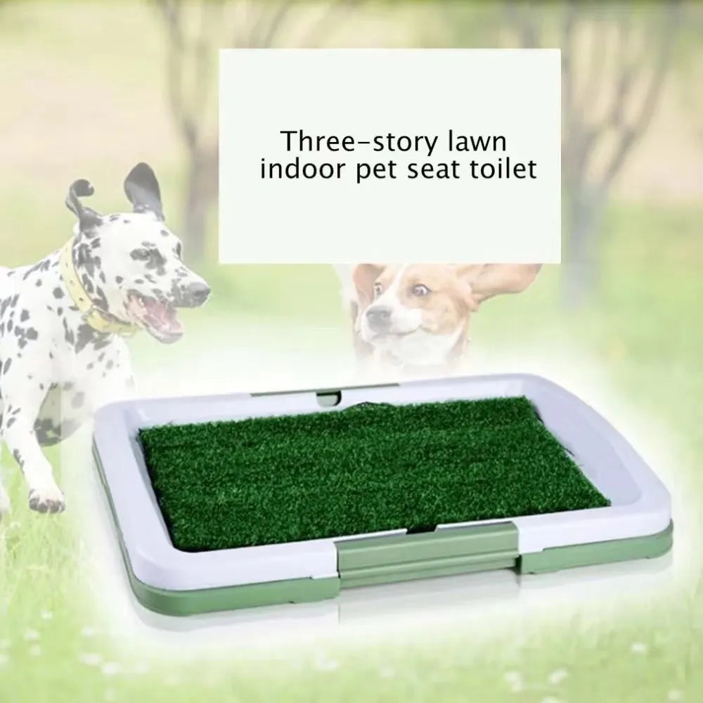 Green artificial turf dog toilet with removable plastic collection tray for indoor potty training.