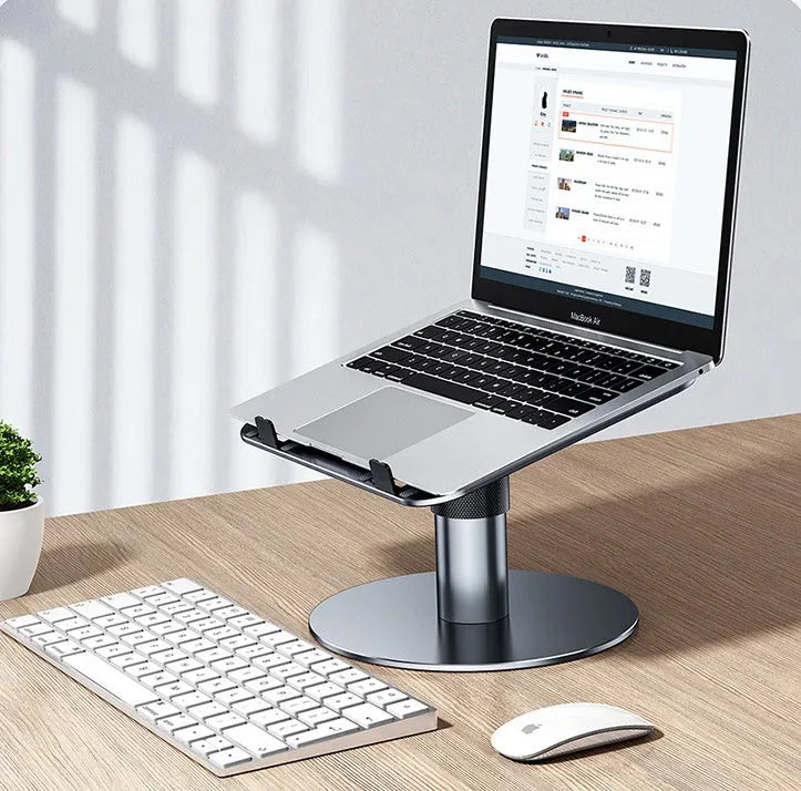 Silver aluminium car laptop stand with adjustable height and 360-degree rotating base on a car seat.