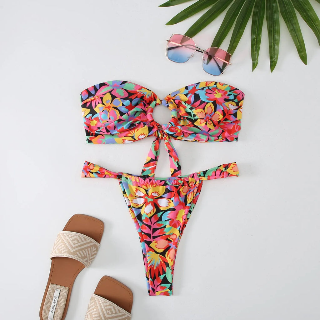 Women's floral print tube top bikini with matching briefs on a mannequin.