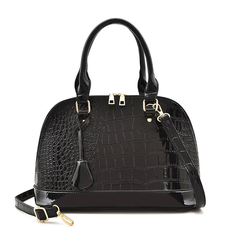 Large shiny PU leather crossbody bag in shell shape design on adjustable strap