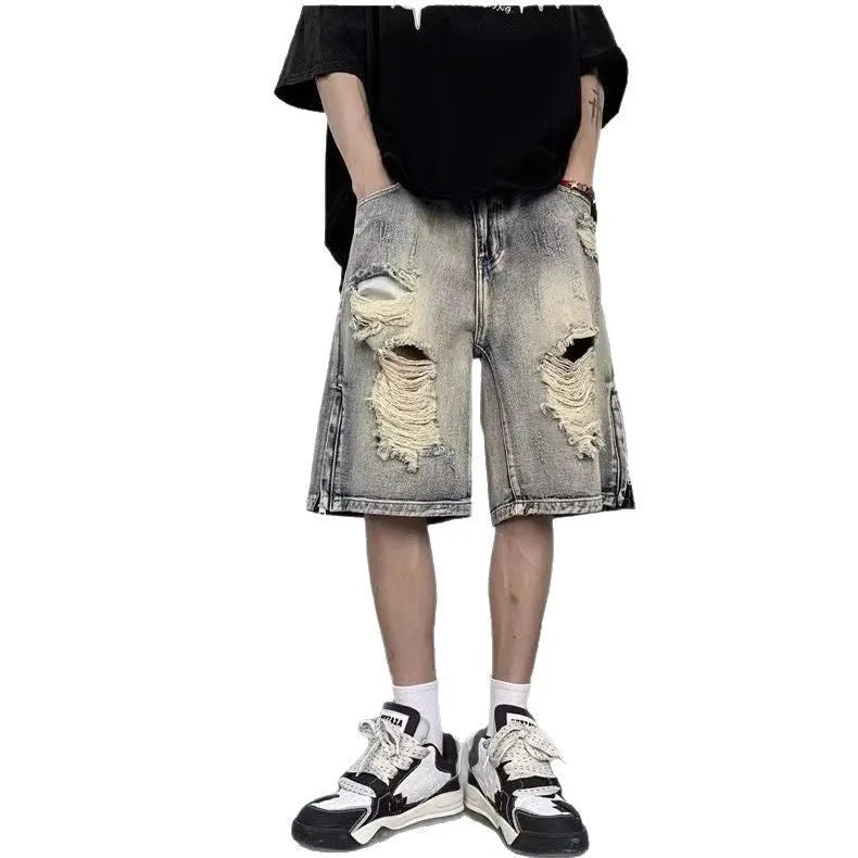 Blue retro-style denim shorts with a wide-leg loose fit and tattered detailing on a model.