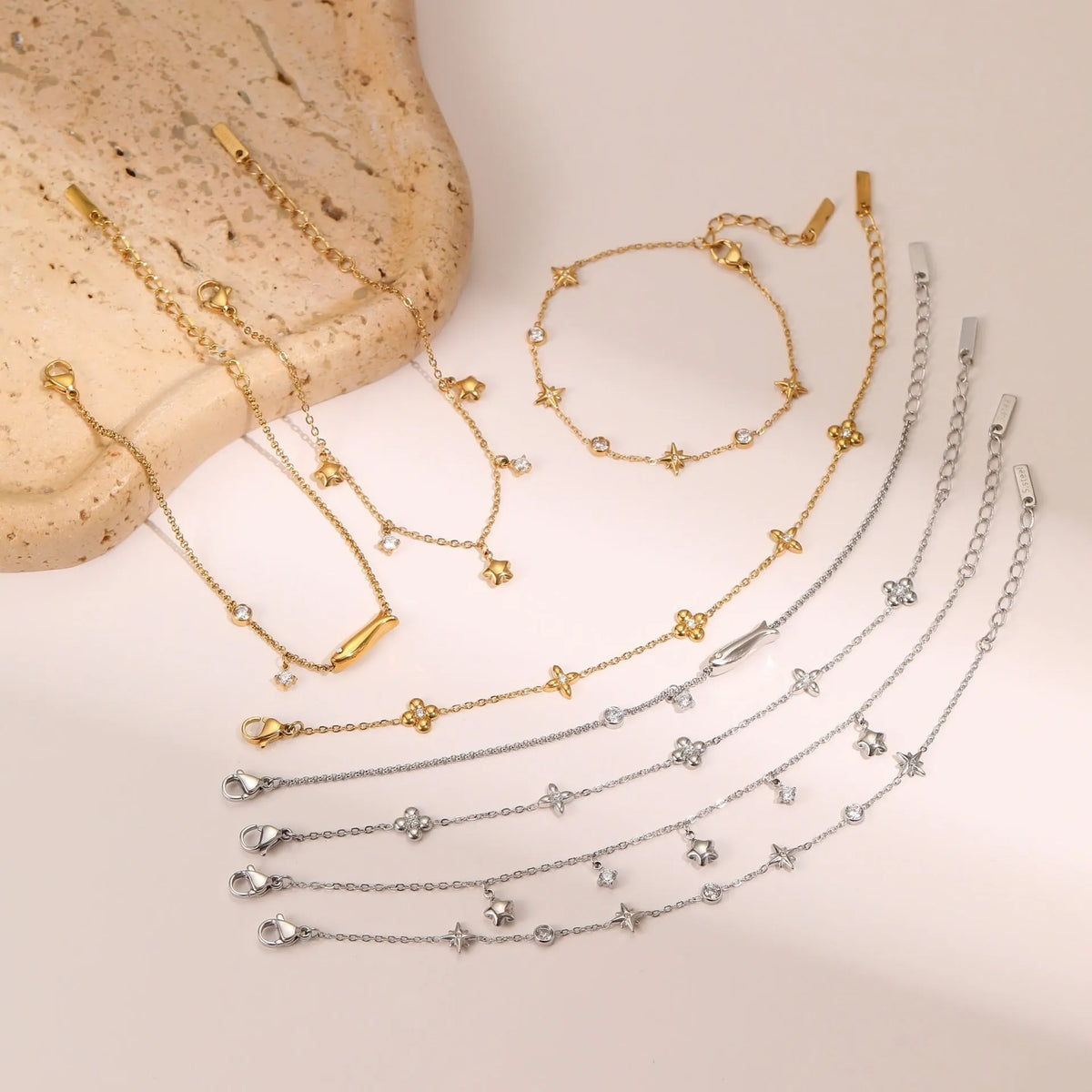 Gold or steel coloured women's bracelet with a hexagonal star zircon pendant on a stainless steel chain.