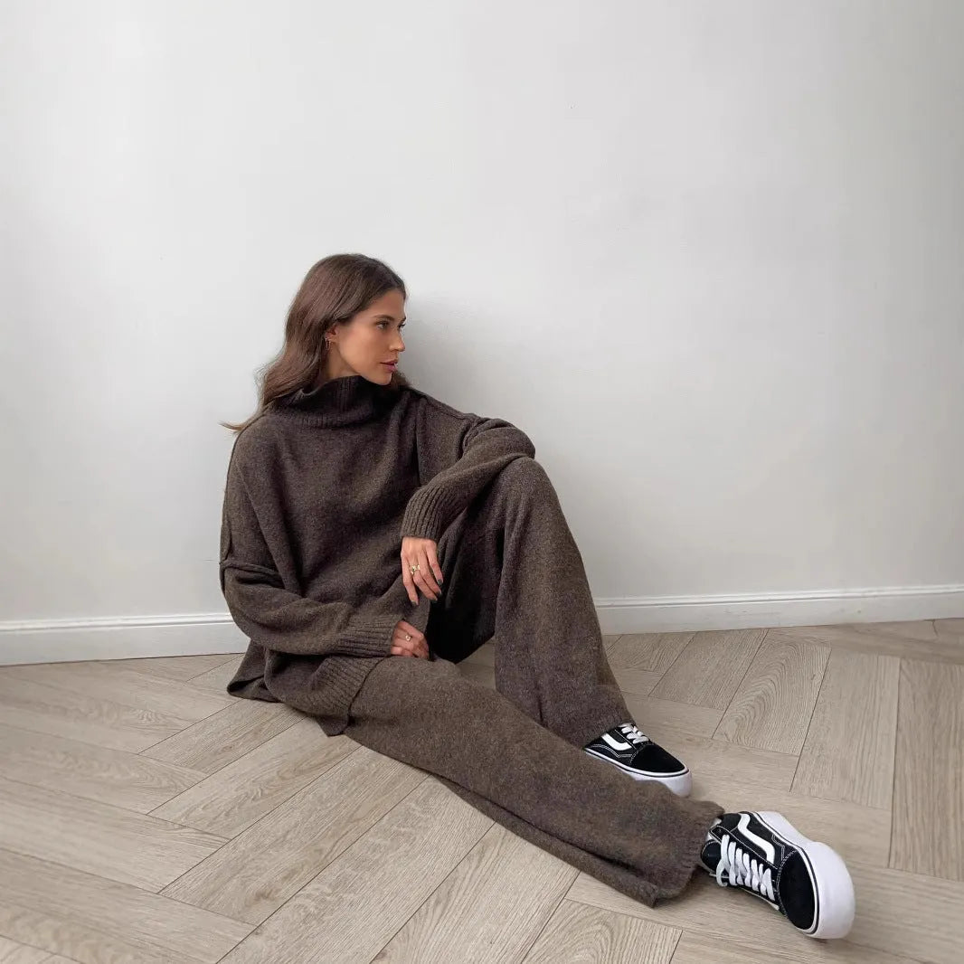 Women's dark grey acrylic sweater suit with side slits and matching trousers