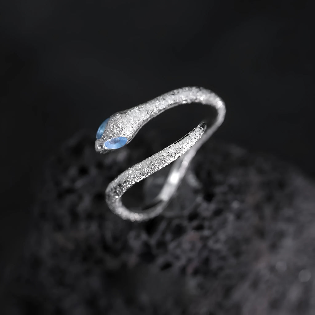 Adjustable snake ring with electroplated white gold colour finish and zodiac design