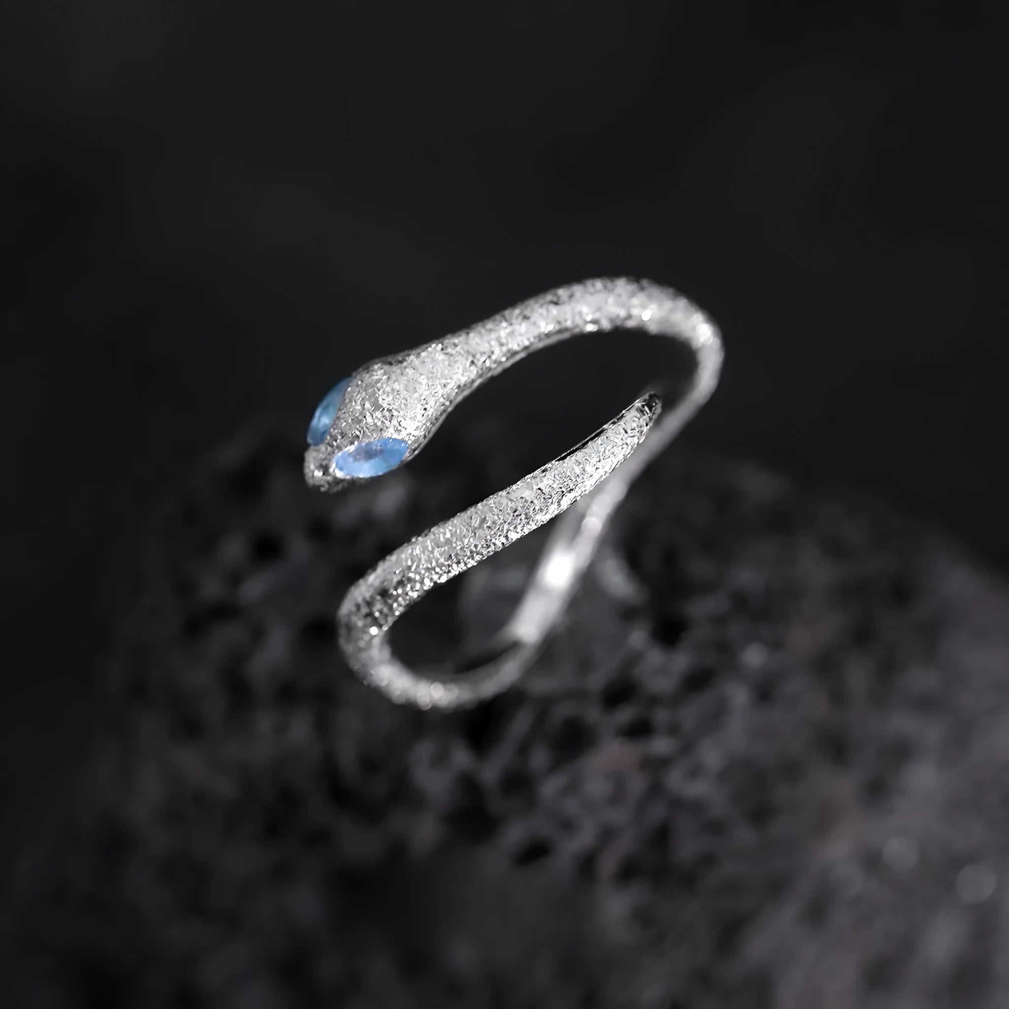 Adjustable snake ring with electroplated white gold colour finish and zodiac design