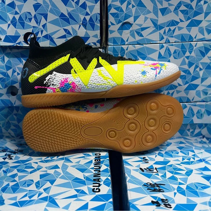 Adult football boots with non-slip rubber outsoles in black and yellow colourway