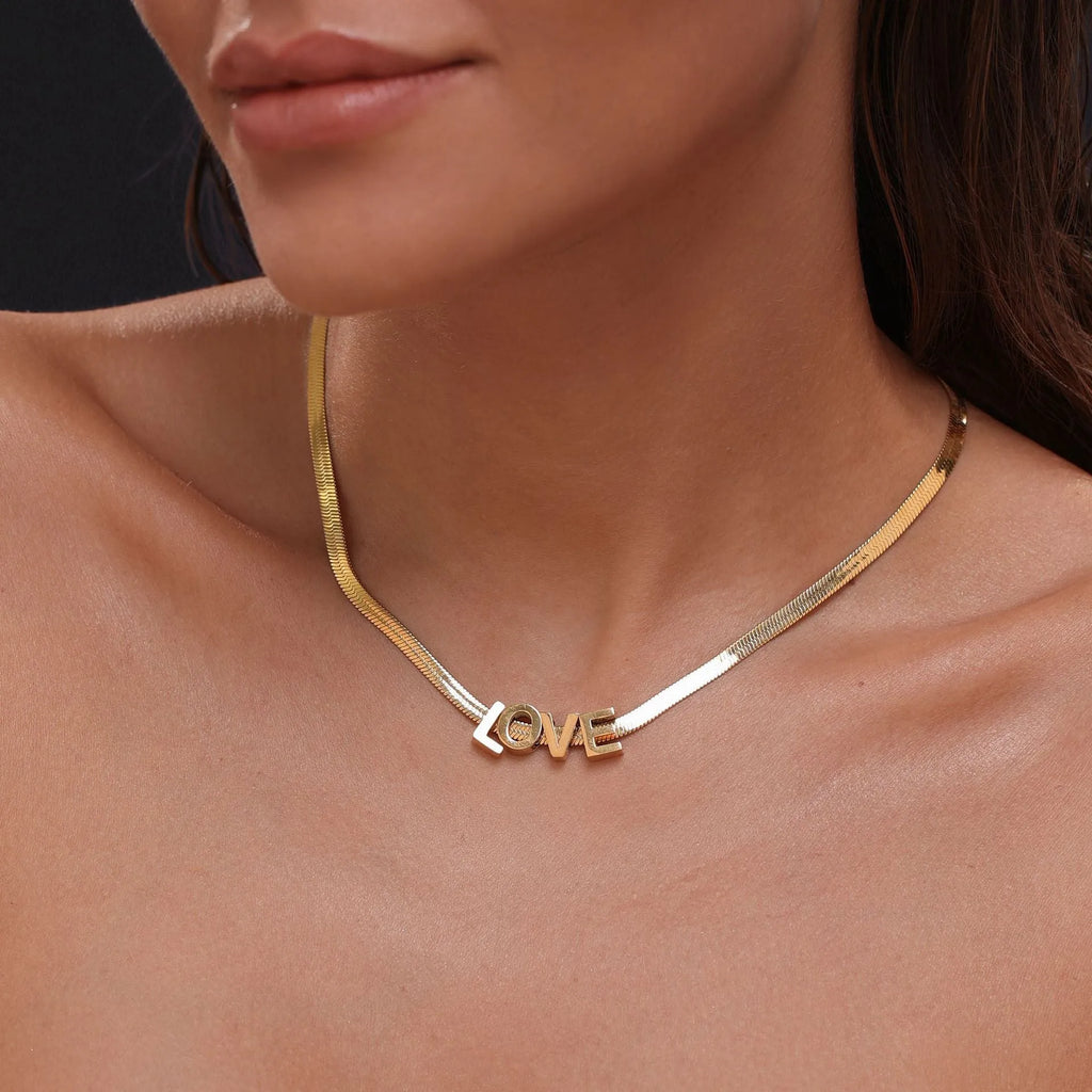 Gold plated titanium steel necklace with the letter A pendant on a 40.5cm chain.