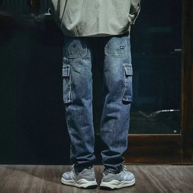 Blue men's loose straight-leg retro jeans with a zip fly, laid flat.