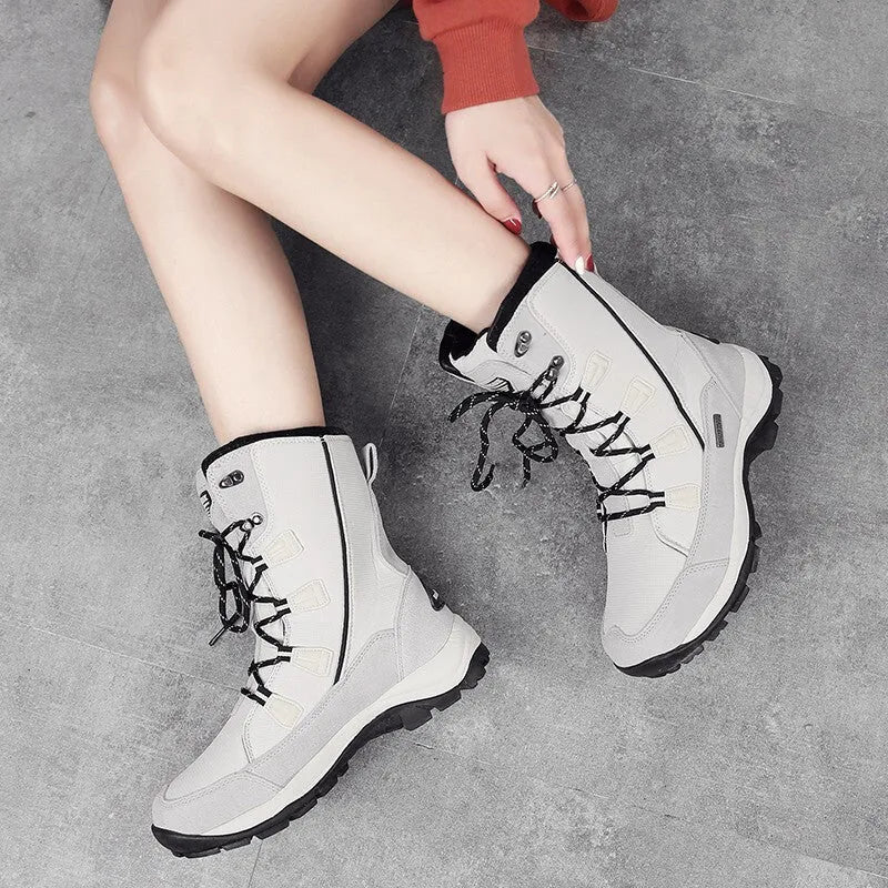 Women's black genuine leather waterproof snow boots with mid-calf length and non-slip rubber soles