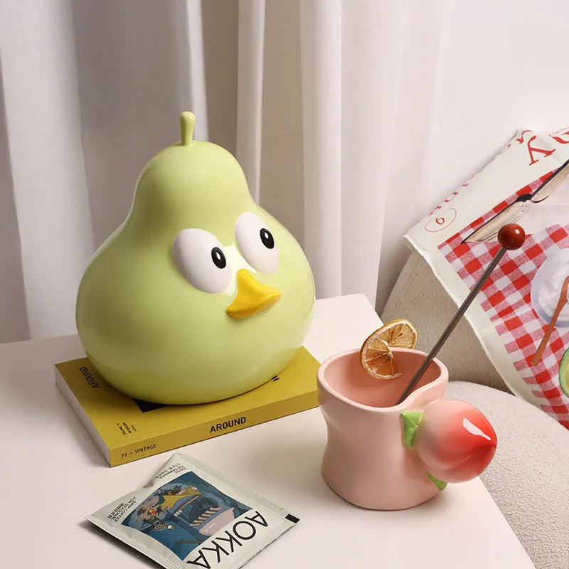 Cute pear-shaped ceramic tissue box in white porcelain with animal design, available in green or black colours