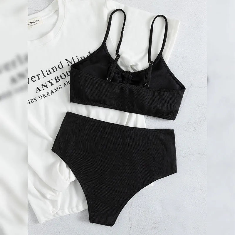 Black women's high-waisted bikini with sling split shorts and sleeveless top