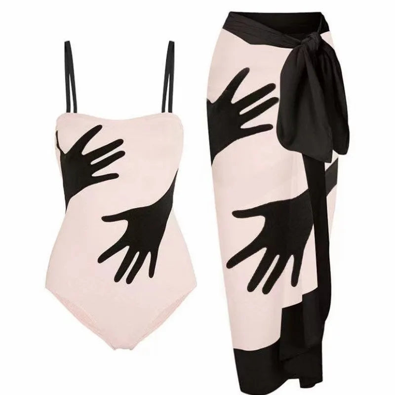 Women's patterned bikini swimsuit with a flowing white tulle skirt attached.