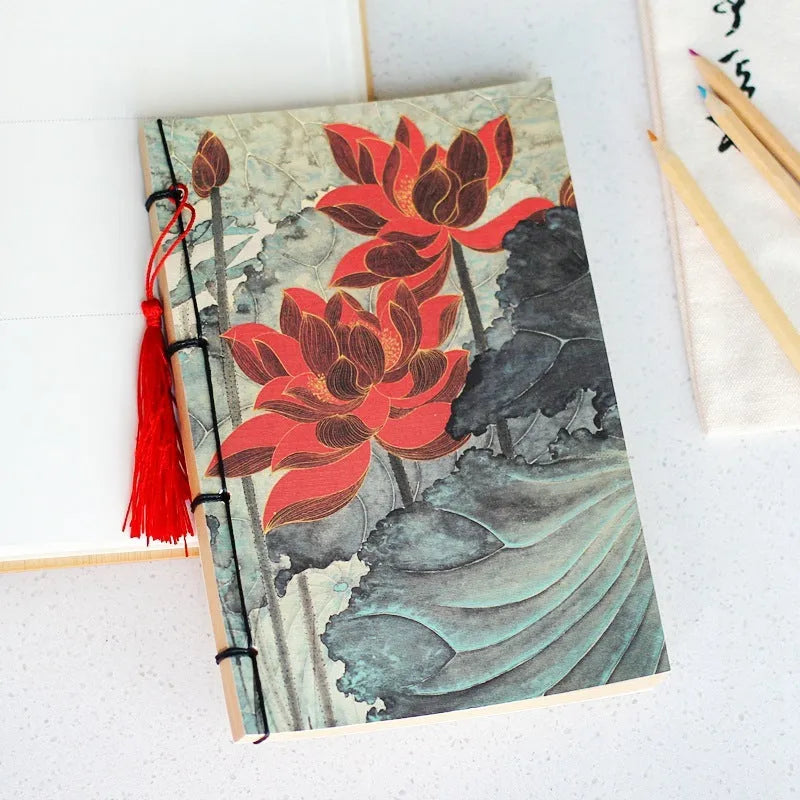 A5 antique wire-bound notebook with retro painting cover, thread binding, and black tassels.