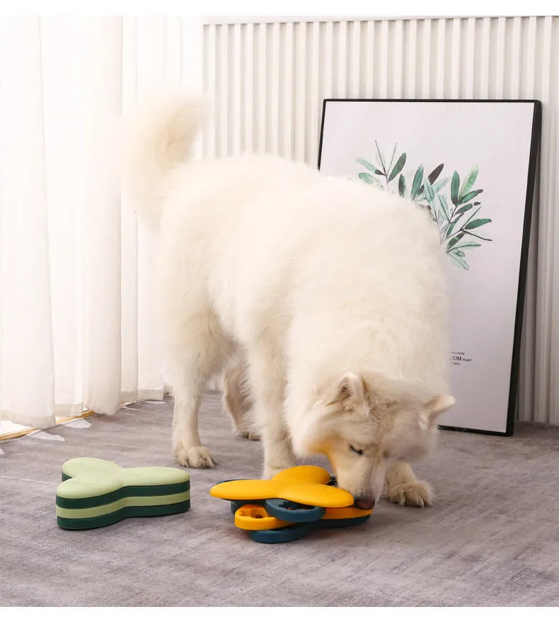 Green and yellow dog puzzle toy with bone-shaped covers and non-slip base.