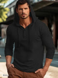 Man wearing a dark blue casual cotton hoodie pullover with long sleeves.