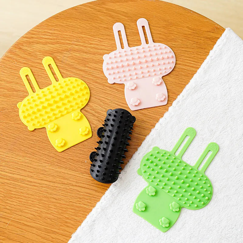 Silicone cat grooming comb and scratcher set with adjustable strap in black, green, pink, or yellow.