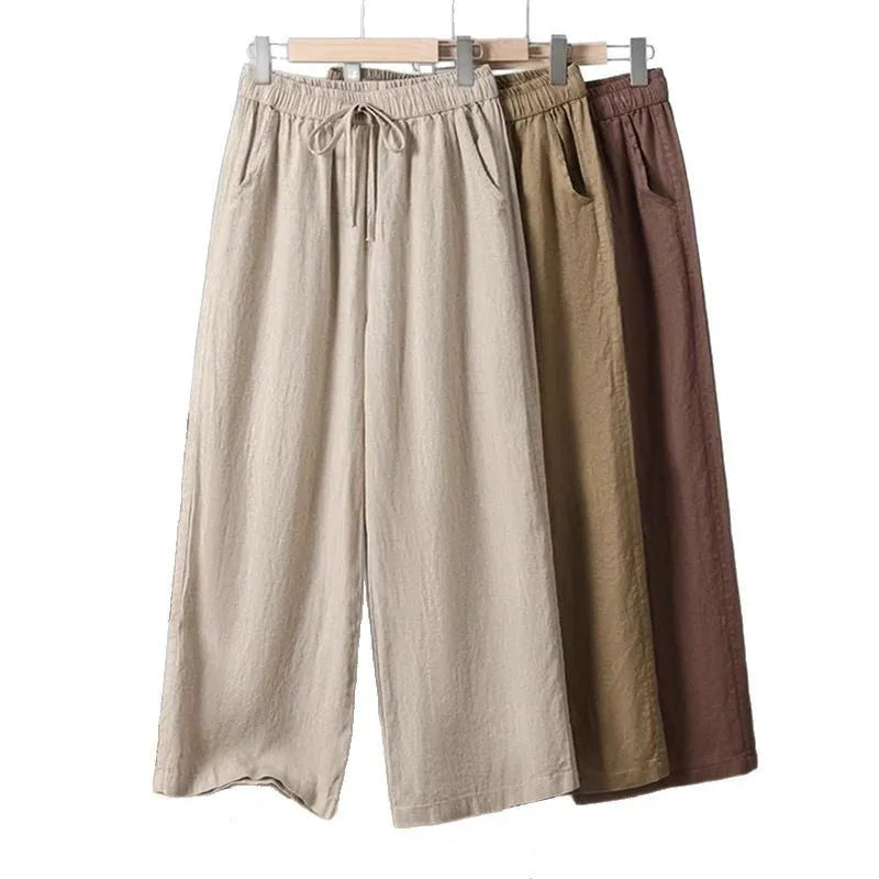 Women's straight-leg casual trousers with an elastic drawstring waist, shown in apricot colour.