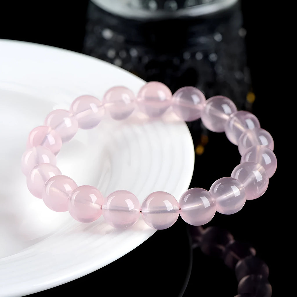 Natural starlight crystal round bead bracelet in pink with polished finish