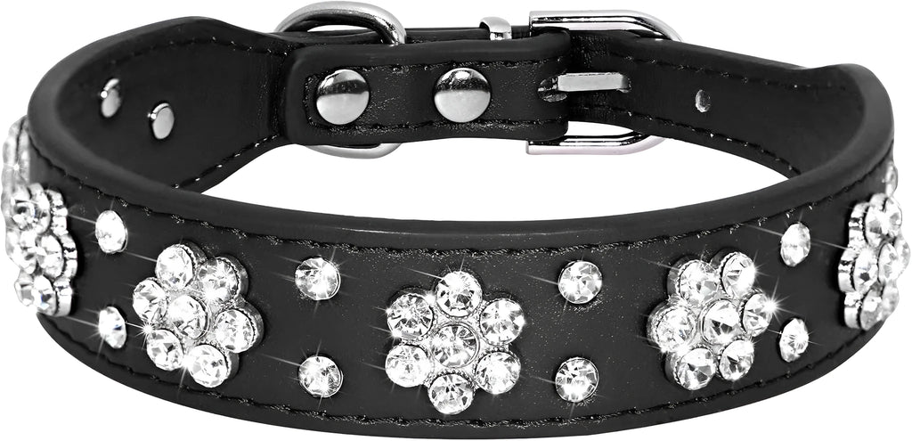 Black dog collar with studded rhinestone flower pattern and a metal D-ring on a white background