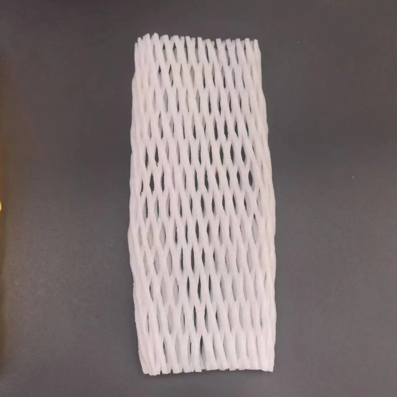 White foam fruit protection nets showing different sizes for apples, pears and peaches