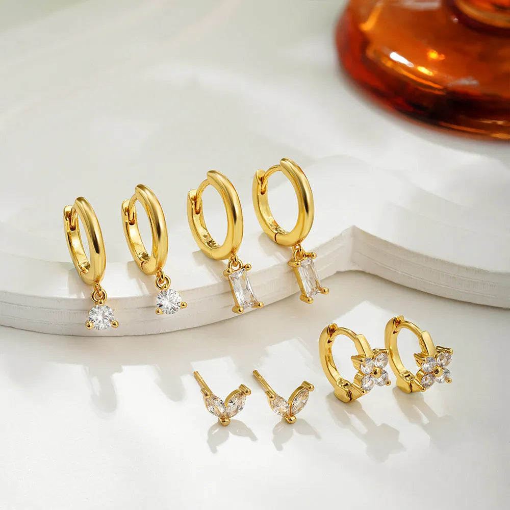 Geometric copper earrings set with zircon stones in gold or silver electroplating, showing star and square designs