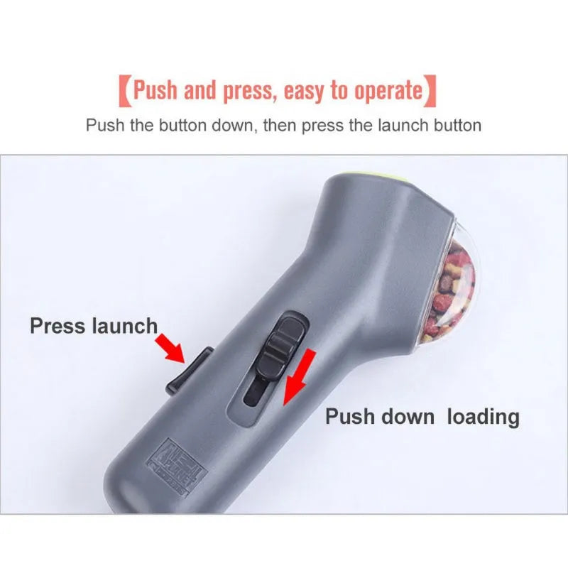 Grey pet snack catapult launcher for dogs and cats, showing compact size and trigger mechanism.