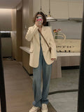 Korean style small suit jacket in polyester fabric, shown in milky white colour with long sleeves and pockets