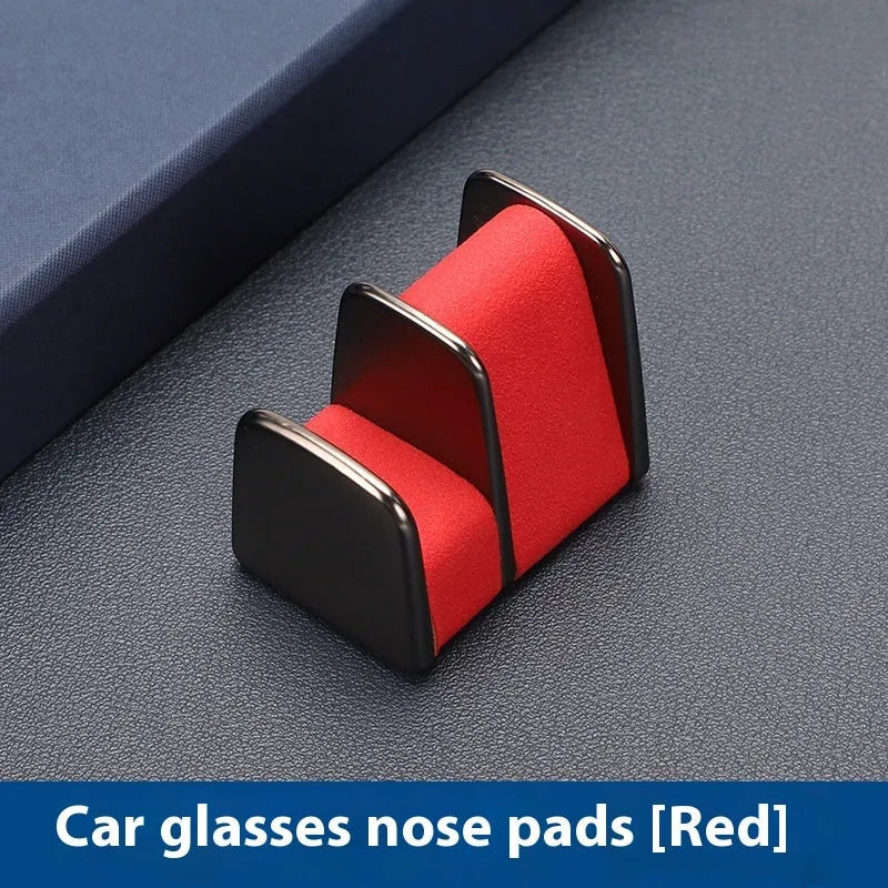 Zinc alloy and leather sunglasses clip holder for car dashboard in black, grey, green, or red.