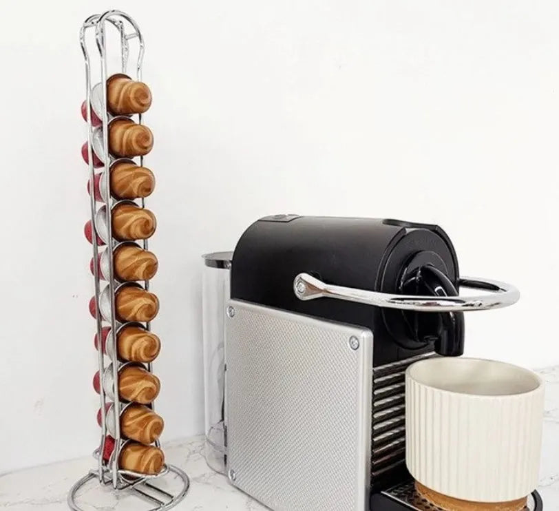 Black wrought iron coffee capsule storage rack holding twenty pods on display shelves.