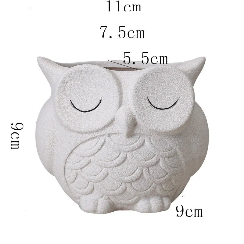Handmade ceramic owl-design succulent pot in frosted light pink, white, green, or blue, measuring 11cm by 9cm.