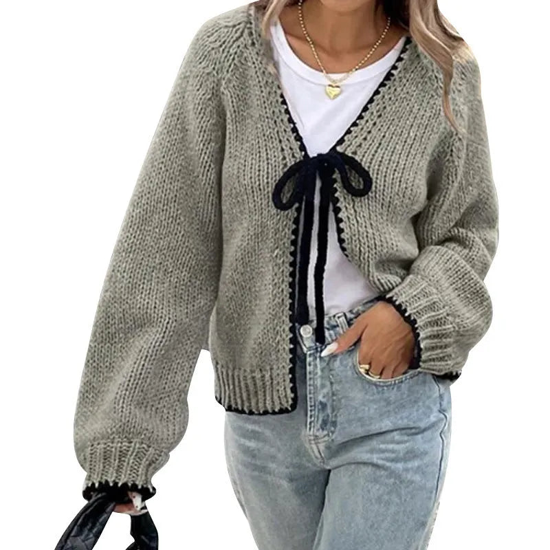 Grey lace-up cardigan with crocheted flower details and loose long sleeves