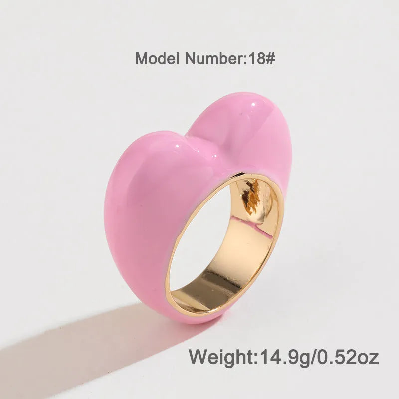 Three-dimensional heart-shaped enamel ring in a choice of colours on a zinc alloy band.
