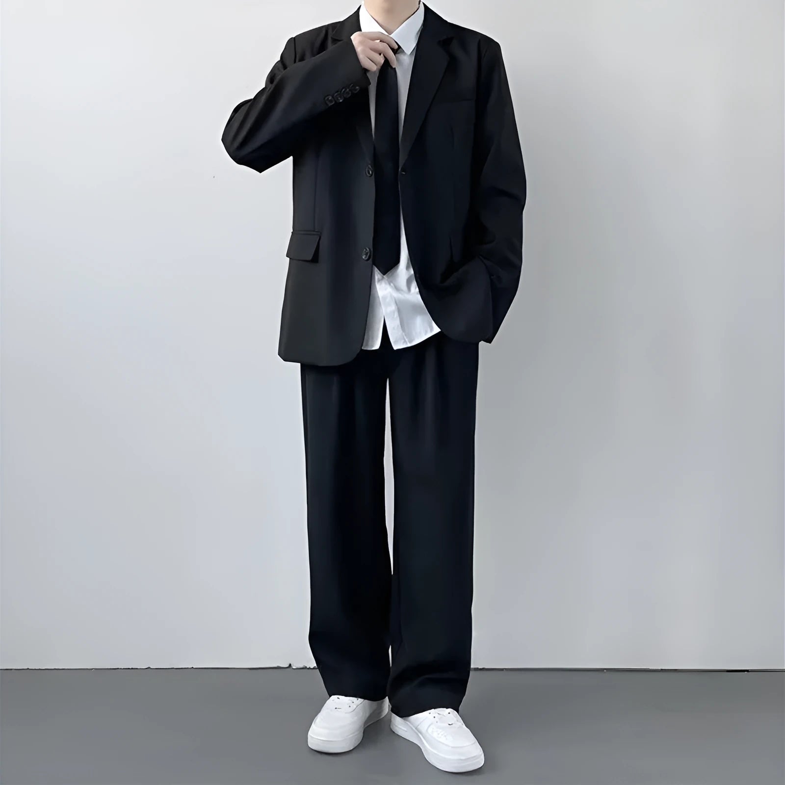 Plus size loose fit men's suit jacket and trousers set with white shirt and tie on a hanger
