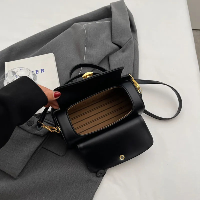 Women's personalised PU leather messenger bag with letter monogram, shown in beige colour with visible stitching.