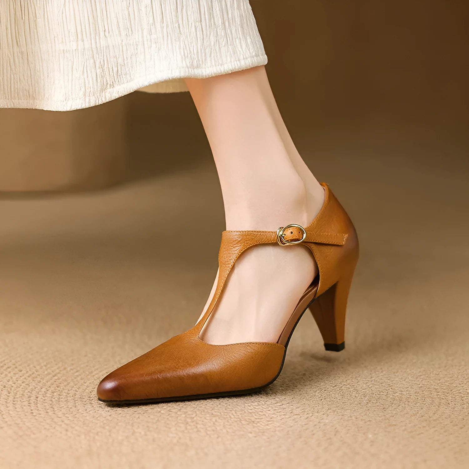 Brown women's retro T-strap closed toe sandals with a chunky high heel on a white background.