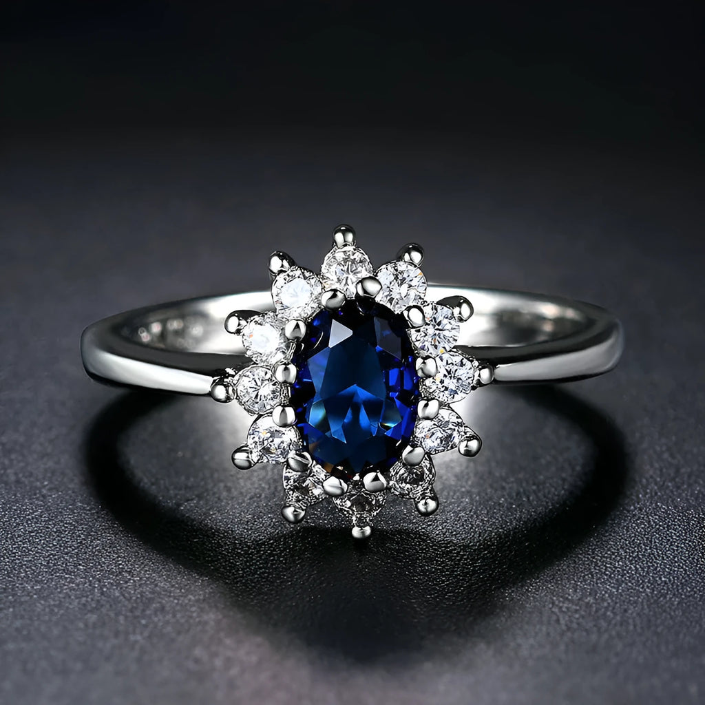 Copper women's ring with electroplated flower design and blue moissanite stone in three colour options