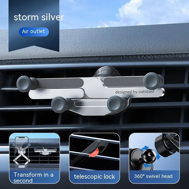 Silver invisible alloy car phone holder mounted on vehicle air outlet with mobile phone in position