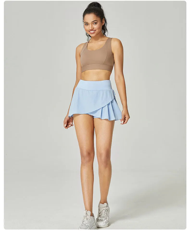 Women's solid colour quick-dry nylon sports shorts with built-in briefs for fitness.