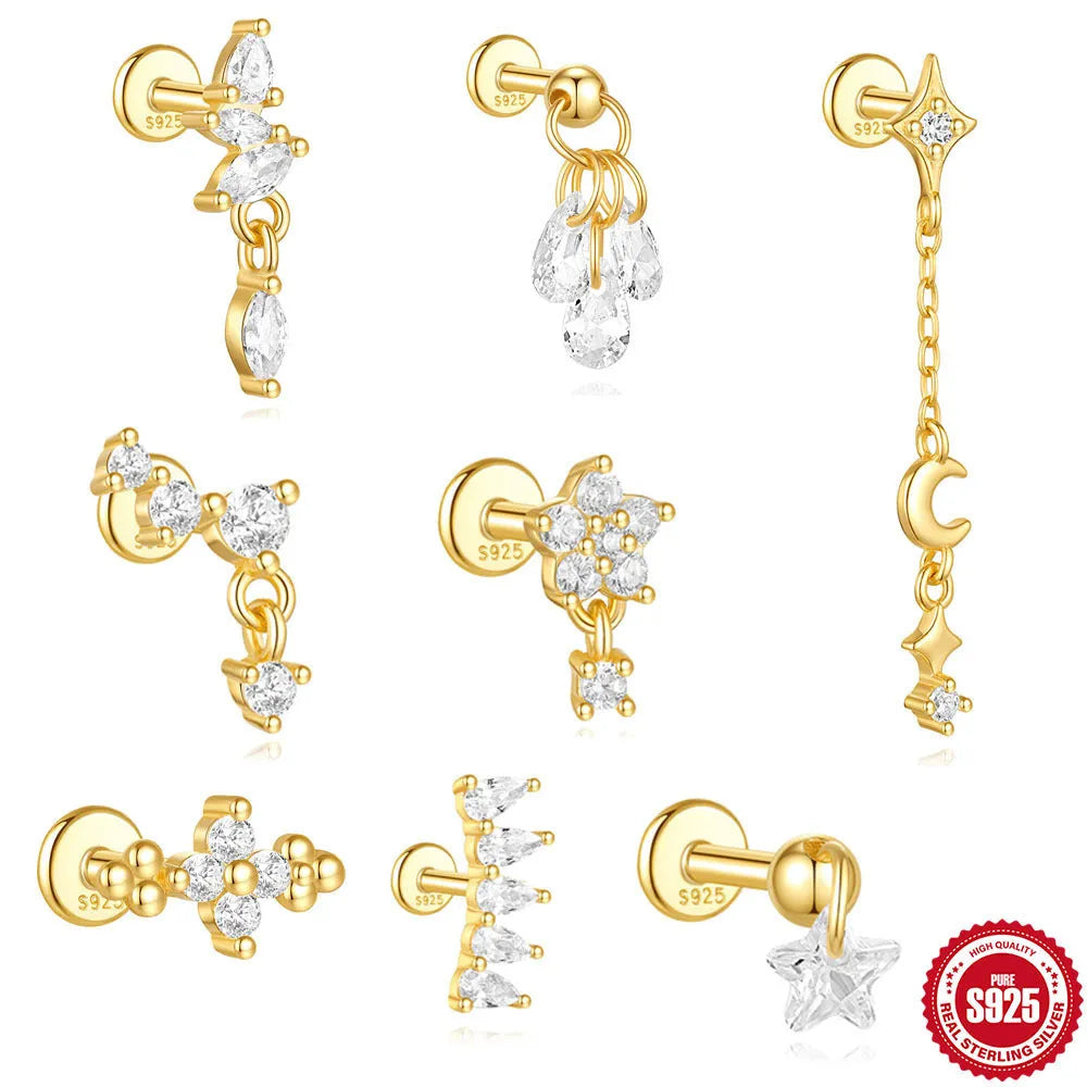 Geometric moon and star sterling silver earrings with diamond accents on a gold-plated finish.
