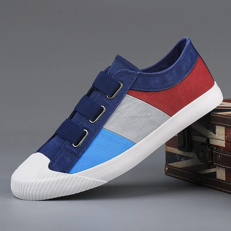 Men's low-top canvas sneaker with elastic band closure in beige colour with contrast stitching.