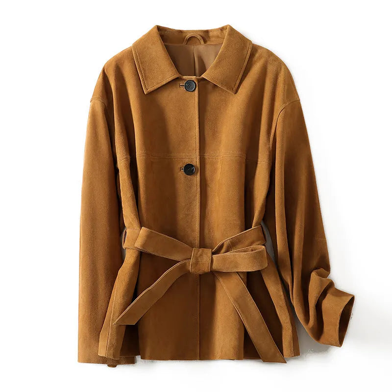 Women's caramel mocha cashmere coat with Peter Pan collar and belt, showing leather stitching and loose retro fit.