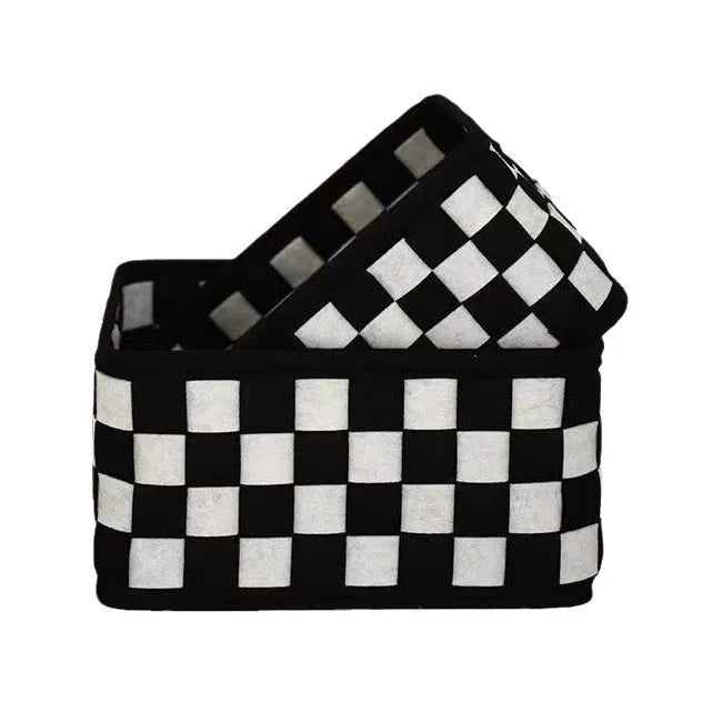 Grey and black checkerboard woven felt folding storage box with collapsible sides.